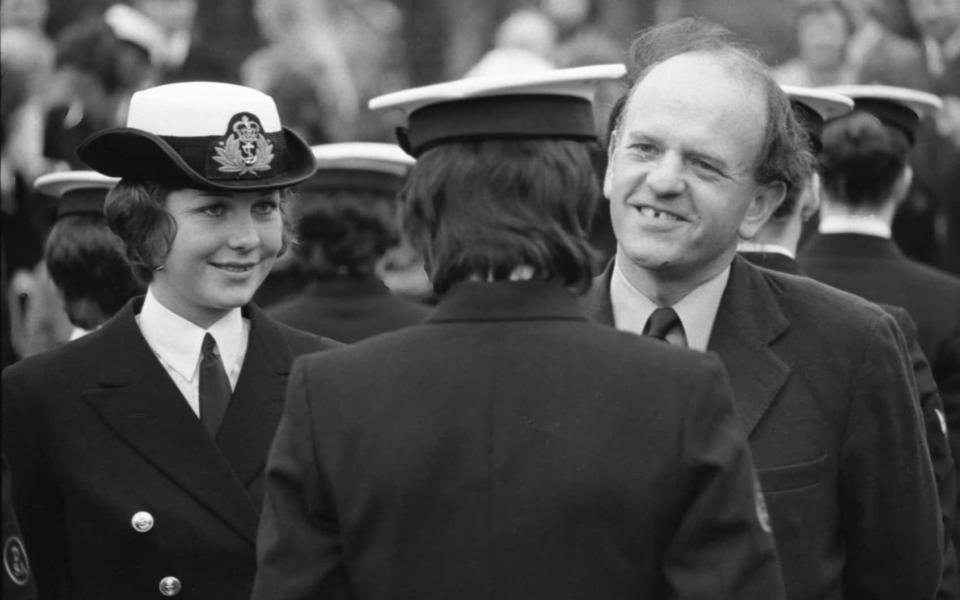 In 1974, during his time as Under-Secretary of State for Defence (Navy), Judd is accompanied by Third Officer Carole Masters as he inspects a passing-out parade at HMS Dauntless, the Wren training establishment in Berkshire - Paul Armiger