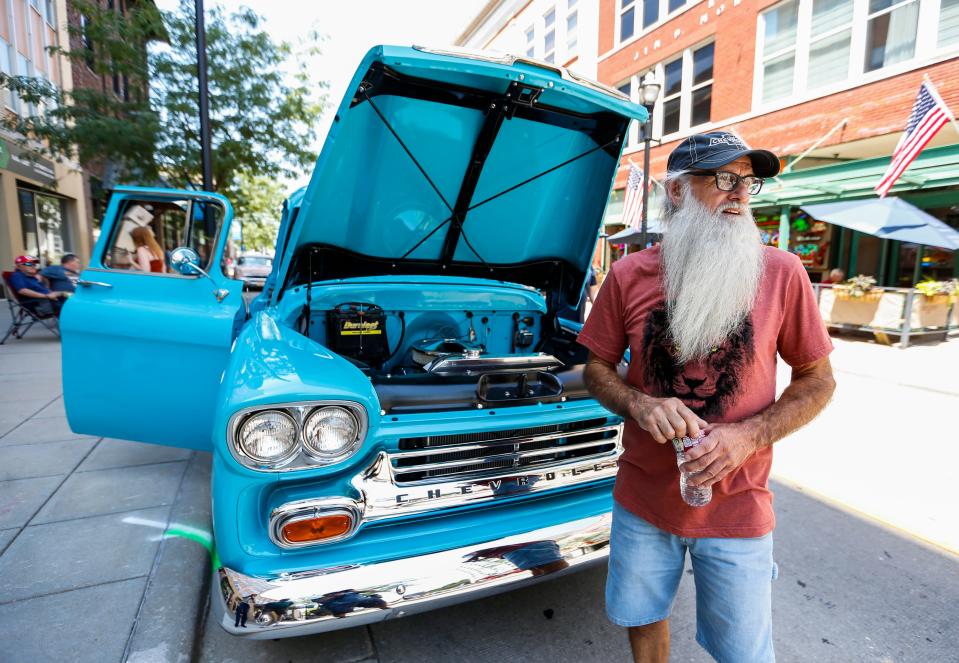 Springfield resident Stan Mahan stands next to his turquoise 1958 Chevy Apache during the Birthplace of Route 66 Festival in Downtown Springfield on Friday, Aug. 12, 2022.