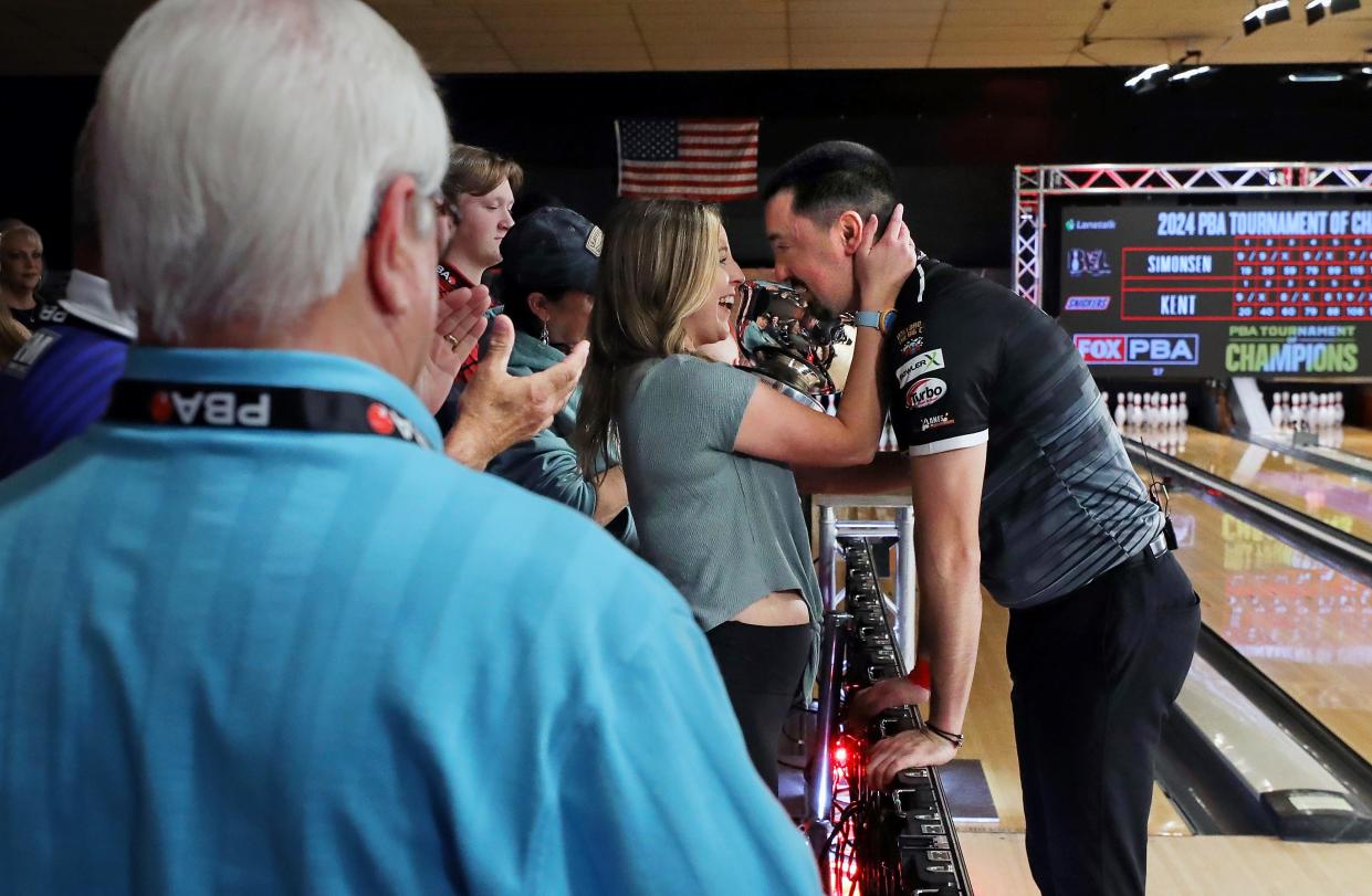 Cassandra Daleski, left, embraces her boyfriend, Marshall Kent, right, after he won the 2024 PBA Tournament of Champions at AMF Riviera Lanes on Sunday.