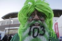 A Saskatchewan Roughriders fan celebrates the103rd CFL Grey Cup championship before the start of the football game between the Ottawa Redblacks and the Edmonton Eskimos in Winnipeg, Manitoba, November 29, 2015. REUTERS/Lyle Stafford