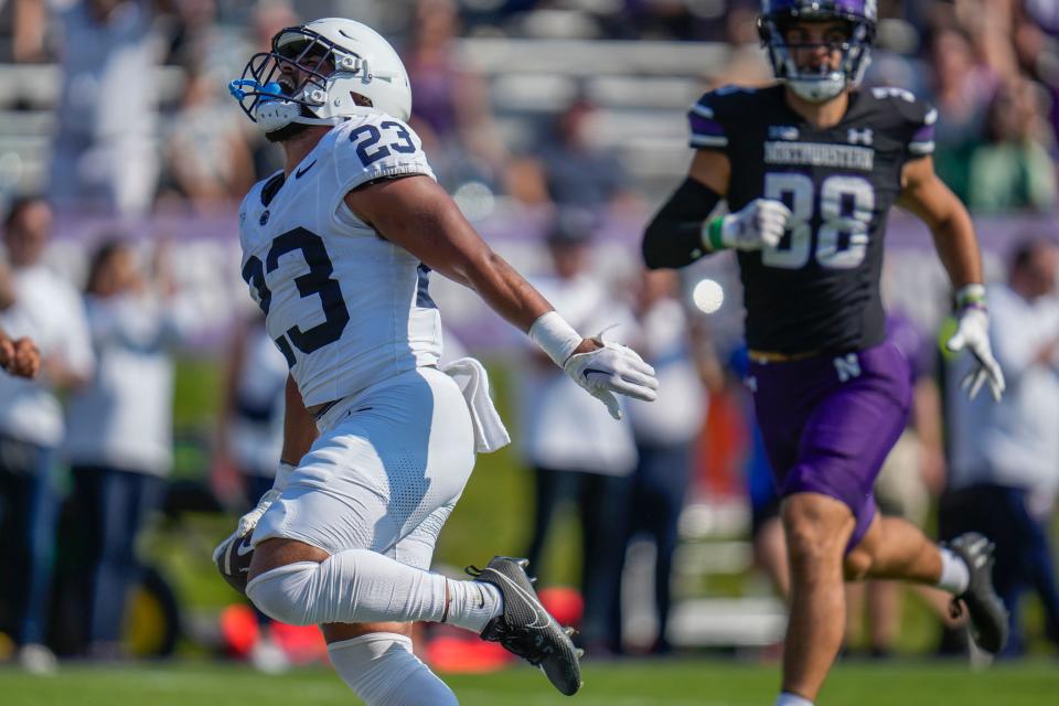 Penn State running back Trey Potts catches a pass and runs in a touchdown during the second half of an NCAA college football game against Northwestern, Saturday, Sept. 30, 2023, in Evanston, Ill. Penn State won 41-13. (AP Photo/Erin Hooley)