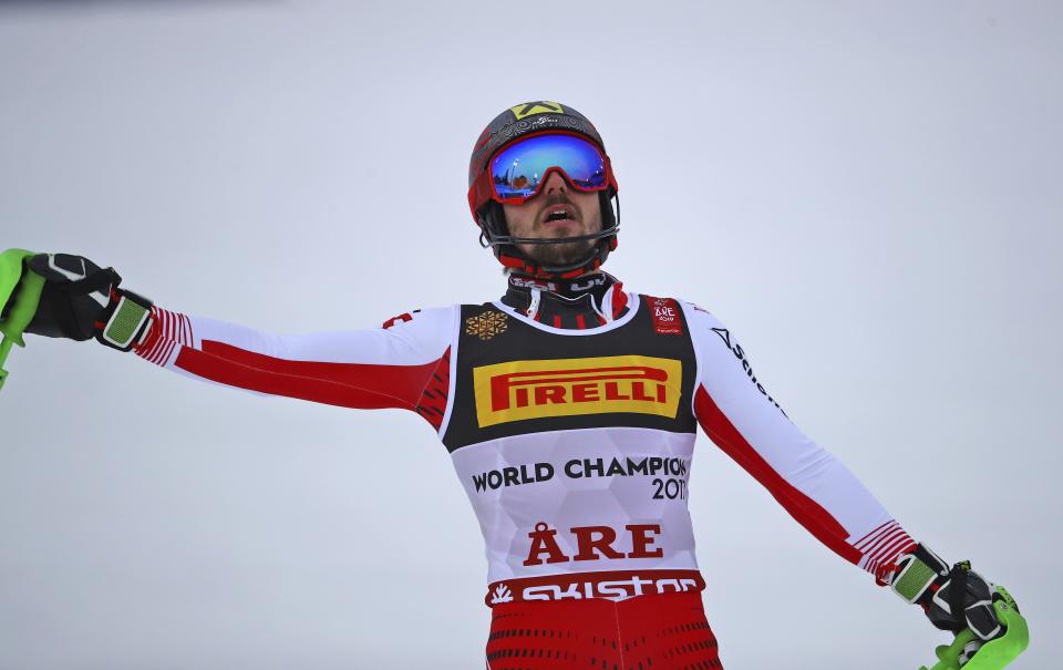 Austria's Marcel Hirscher celebrates winning the men's slalom, at the alpine ski World Championships in Are, Sweden, Sunday, Feb. 17, 2019. (AP Photo/Marco Trovati)