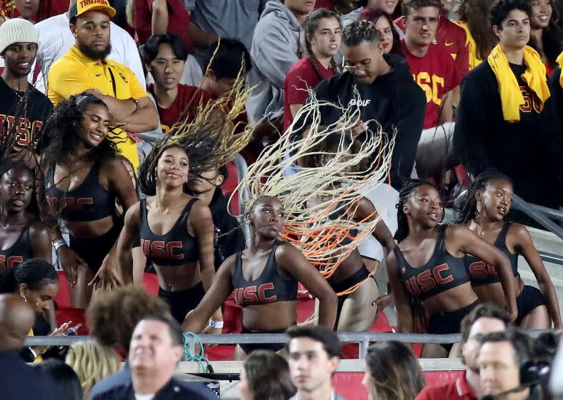 The Cardinal Divas perform in the stands during the USC versus Arizona State game