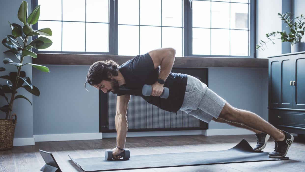 young men exercising at home