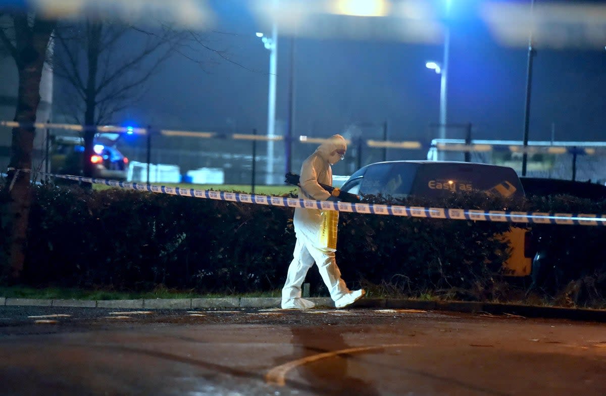 A forensics officer at the scene of a shooting in the Killyclogher Road area (PA)