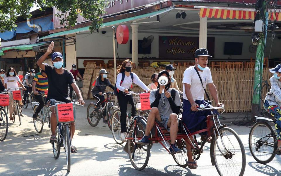 Protesters on bicycles demand democracy - AFP