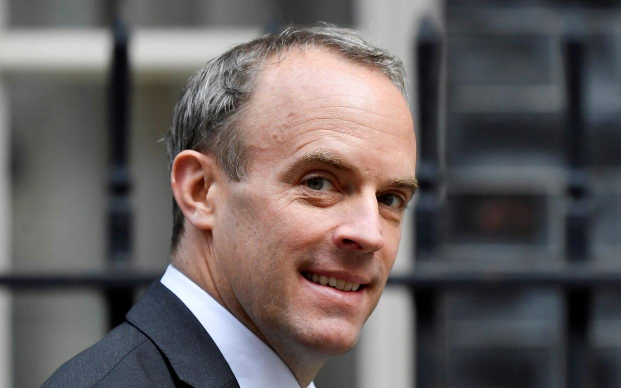 Britain's Foreign Affairs Secretary Dominic Raab walks outside Downing Street in London - Toby Melville/REUTERS