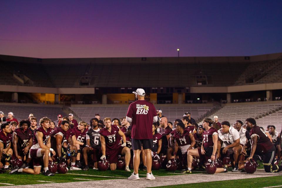 Texas State head coach G.J. Kinne addresses his team two days before last year's season-opening upset of Baylor. Kinne led Texas State to an 8-5 season and a bowl win over Rice.