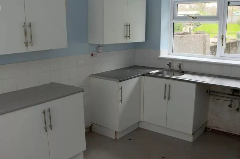 The kitchen before the renovation was white but a bit tatty