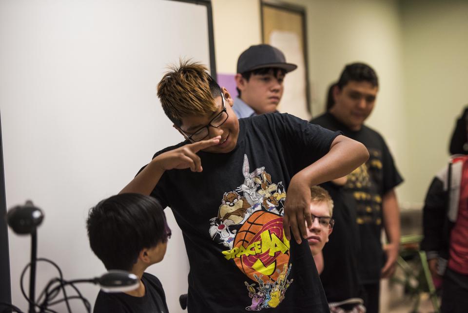 Students&nbsp;at the Albuquerque Sign Language Academy sign to audience members during an event.