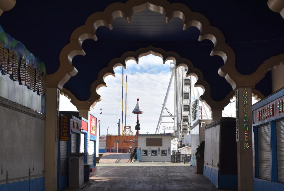 A decorative arch leading to Steel Pier in Atlantic City shows design elements from the former Trump Taj Mahal.