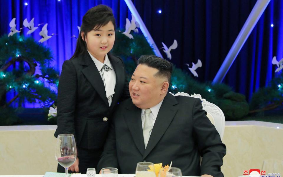 Kim Jong-un talks with his daughter Kim Ju-ae at a banquet to celebrate the 75th anniversary of the Korean People's Army, in Pyongyang - KCNA