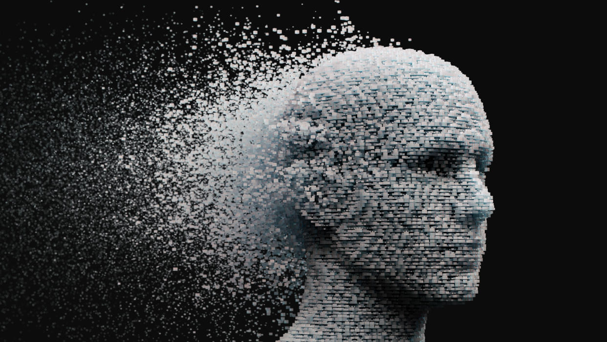 3D dissolving human head made with cube shaped particles.