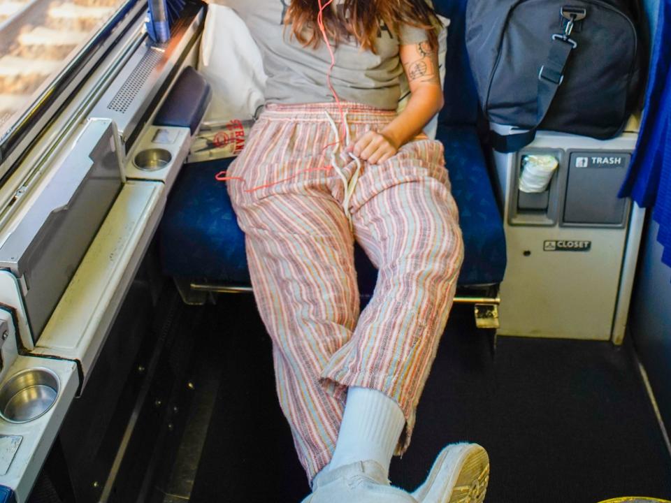 The author wears pajamas in an Amtrak roomette