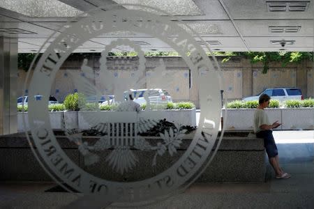 People wait outside the State Department in Washington. REUTERS/Yuri Gripas