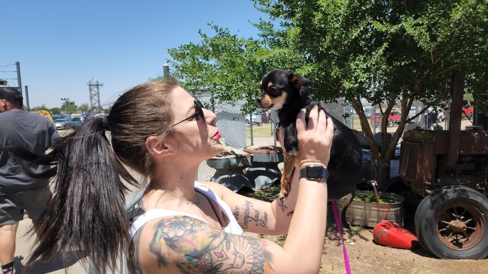 A pet owner gives her Chihuahua a little extra attention Sunday at Mission Muttfest held at Starlight Ranch.