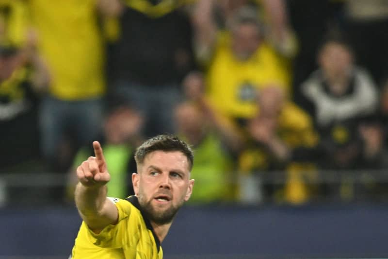 Dortmund's Niclas Fuellkrug celebrates scoring his side's first goal during the UEFA Champions League semi-final first leg soccer match between Borussia Dortmund and Paris Saint-Germain at Signal Iduna Park. Bernd Thissen/dpa