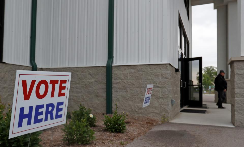 A "vote here" sign stands outside the entrance of the polling station at the Tippecanoe County Fairgrounds on Election Day, Tuesday, May 7, 2024.