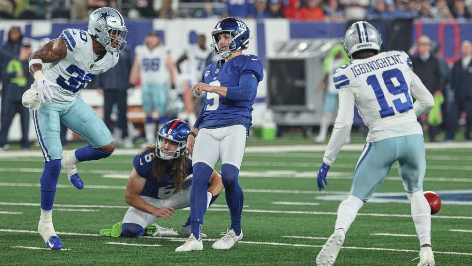 Sep 10, 2023; East Rutherford, New Jersey, USA; Dallas Cowboys safety Juanyeh Thomas (30) blocks a field goal attempt by New York Giants place kicker Graham Gano (9) as cornerback Noah Igbinoghene (19) recovers the block during the first quarter at MetLife Stadium.