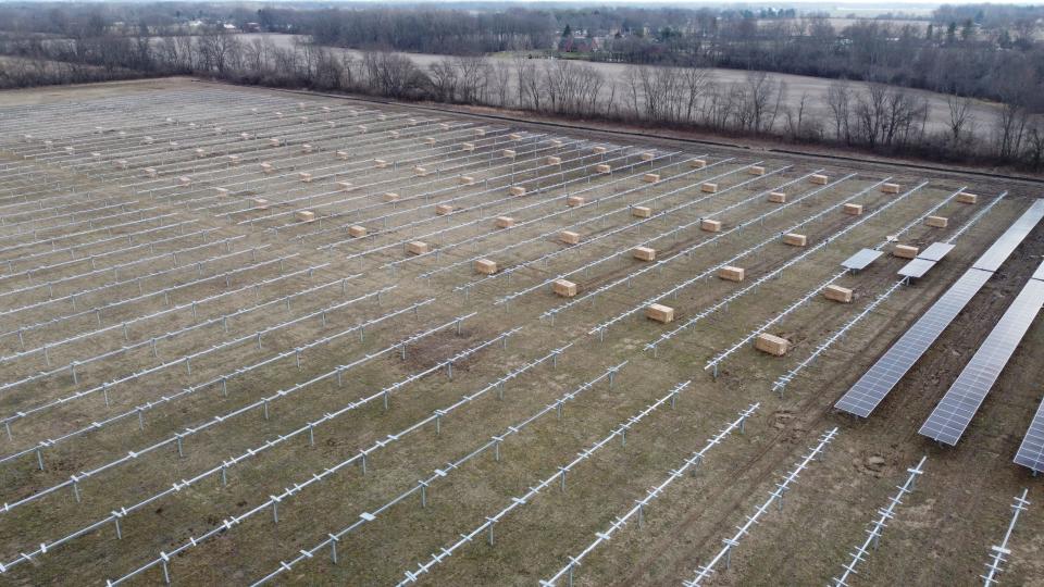 Boxes of solar panels wait for workers to install them at the Hendricks Power Cooperative and Solential Energy array northeast of Danville.