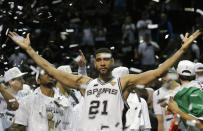 FILE - In this June 15, 2014, file photo, San Antonio Spurs forward Tim Duncan (21) celebrates after Game 5 of the NBA basketball finals in San Antonio. Kobe Bryant, Tim Duncan and Kevin Garnett. Each was an NBA champion, an MVP, an Olympic gold medalist, annual locks for All-Star and All-Defensive teams. And now, the ultimate honor comes their way: On Saturday night, May 15, 2021, in Uncasville, Connecticut, they all officially become members of the Naismith Memorial Basketball Hall of Fame. (AP Photo/David J. Phillip, File)