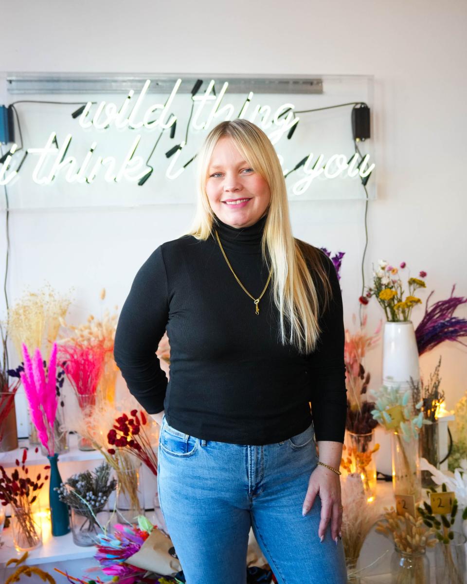 Maya Boettcher poses for a photo in her store on Ingersoll Avenue.