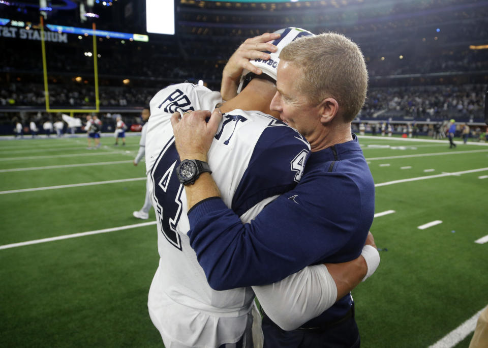 Cowboys quarterback Dak Prescott and head coach Jason Garrett share a moment after upsetting the Saints on Thursday. (AP)