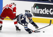 Columbus Blue Jackets forward Nathan Gerbe, right, falls in front of Detroit Red Wings forward Sam Gagner during the first period an NHL hockey game in Columbus, Ohio, Friday, May 7, 2021. (AP Photo/Paul Vernon)