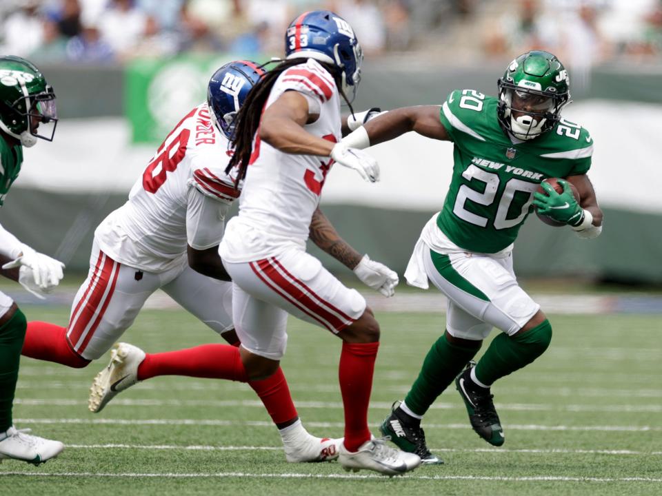 Breece Hall makes a run against the New York Giants.