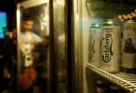 FILE PHOTO: Carlsberg beer cans are seen at a pub in Mumbai, India, October 20, 2018. REUTERS/Danish Siddiqui/File Photo