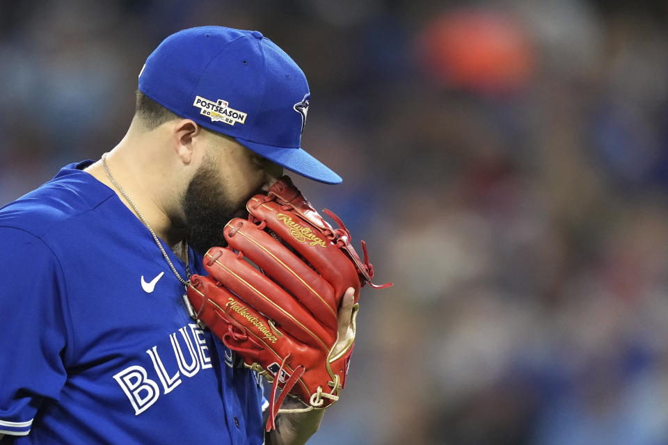 Toronto Blue Jays starting pitcher Alek Manoah reacts as he walks back to the dugout after the top of the fourth inning of Game 1 in an AL wild-card baseball playoff series against the Seattle Mariners in Toronto on Friday, Oct. 7, 2022. (Nathan Denette/The Canadian Press via AP)