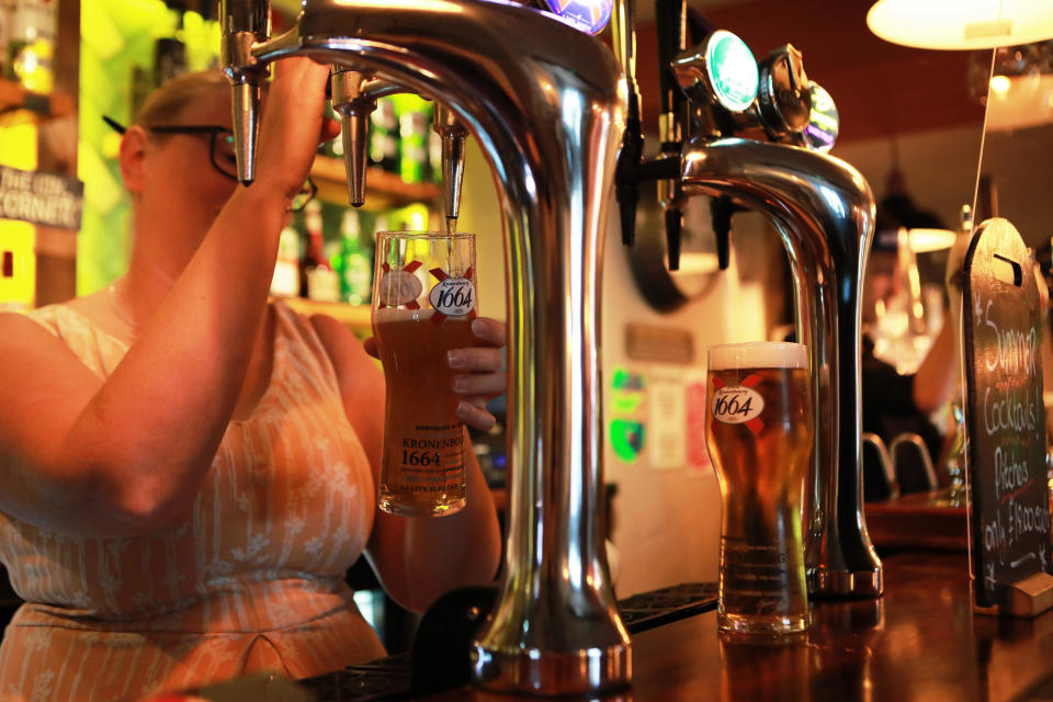 A member of staff pours a pint inside the Black Horse Inn in Haxby, York, on Super Saturday as pubs and other stores reopen after lockdown measures are relaxed in England