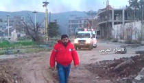 A still image taken from a video uploaded by the Syrian Army on April 19, 2017, shows Red Crescent vehicles leaving the the town of Zabadani, near Damascus, Syria. Syrian Army/Handout via Reuters TV