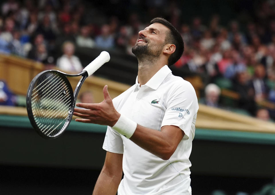 Serbia's Novak Djokovic reacts during his match against Vit Kopriva of the Czech Republic on their first round match at the Wimbledon tennis championships in London, Tuesday, July 2, 2024. (Mike Egerton/PA via AP)