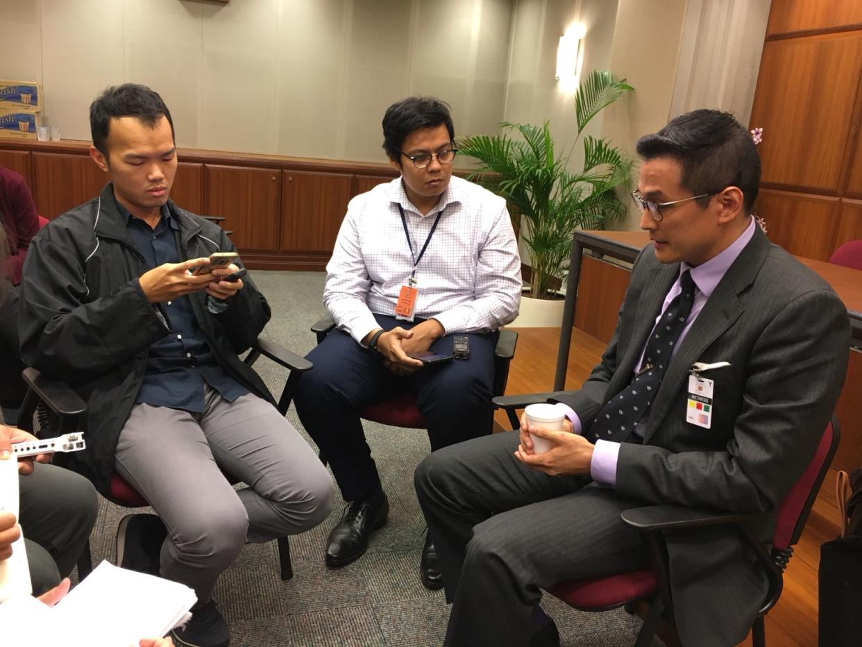 Historian Thum Ping Tjin (right) speaking to reporters after attending a hearing headed by the Select Committee on Deliberate Online Falsehoods on 29 March 2018. Photo: Nicholas Yong/Yahoo News Singapore