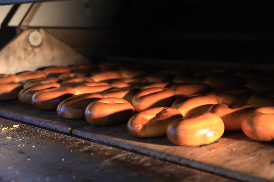 A batch of plain bagels bake in the oven at Eastdale Avenue Bagels on February 21, 2022. 