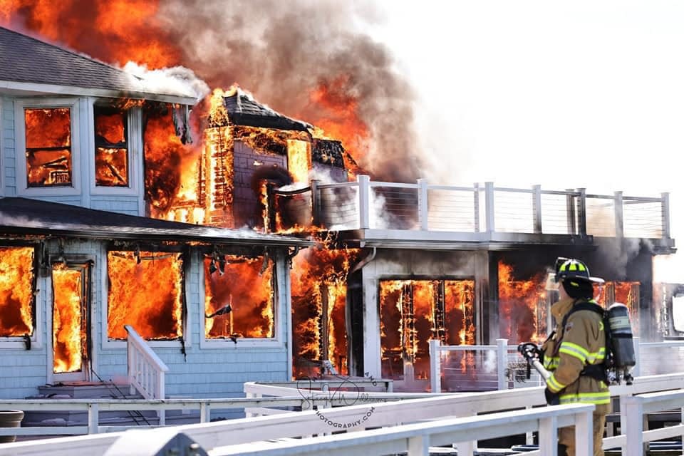 Fire crews respond to massive structure fires at the Old Club property on Wednesday, March 8, 2023, on Harsens Island. Six structures were affected, according to Police Chief Mike Koach.