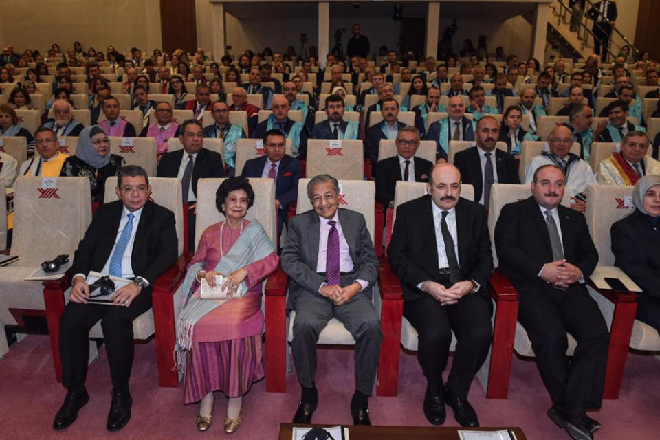 Tun Dr Mahathir Mohamad, Tun Dr Siti Hasmah Mohd Ali and Foreign Minister Saifuddin Abdullah attend a ceremony at the Ankara Yildirim Beyazit University in Ankara July 25, 2019. — Bernama pic