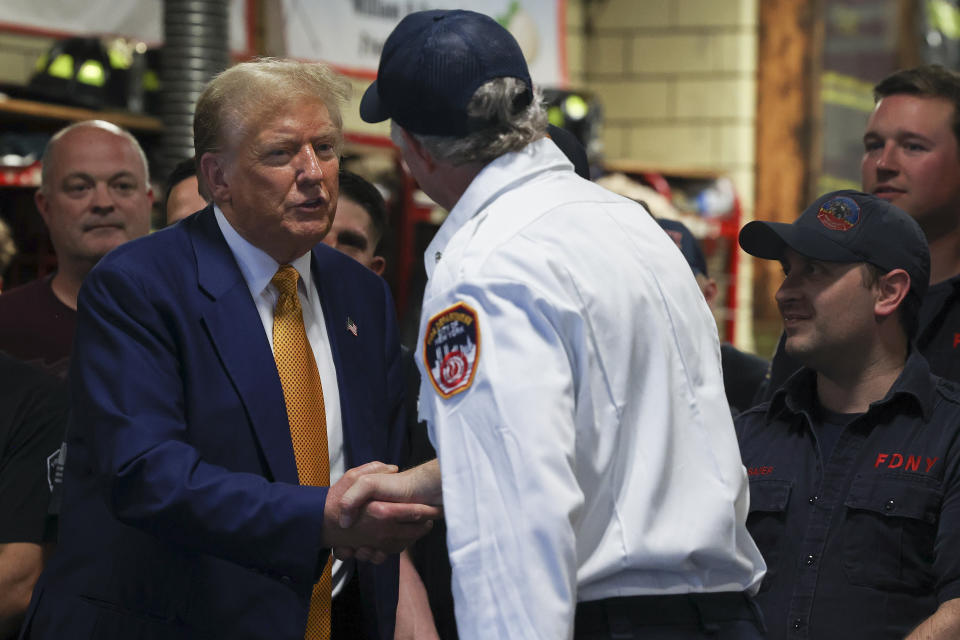 Former President Donald Trump meets with firefighters at a midtown Manhattan firehouse,Thursday, May 2, 2024, in New York. (AP Photo/Yuki Iwamura)