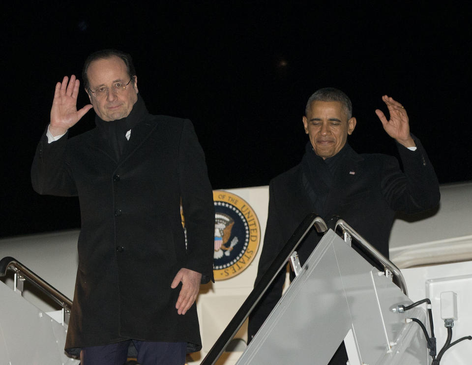 President Barack Obama, right, and French President Francois Hollande, left, wave during their return to Andrews Air Force Base on Air Force One, Monday, Feb. 10, 2014, from Charlottesville, Va., after touring Monticello, President Thomas Jefferson’s estate. (AP Photo/Pablo Martinez Monsivais)