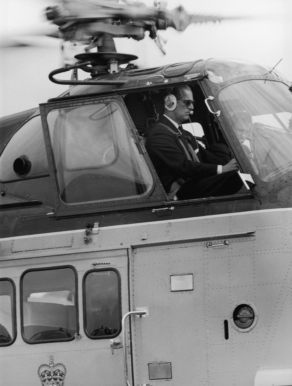 Prince Philip at the controls of the royal helicopter, July 28, 1965.<span class="copyright">George W. Hales—Fox Photos/Hulton Archive/Getty Images</span>