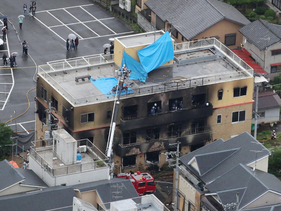 This aerial view shows the rescue and recover scene after the fire (Photo by JIJI PRESS / JIJI PRESS / AFP) 