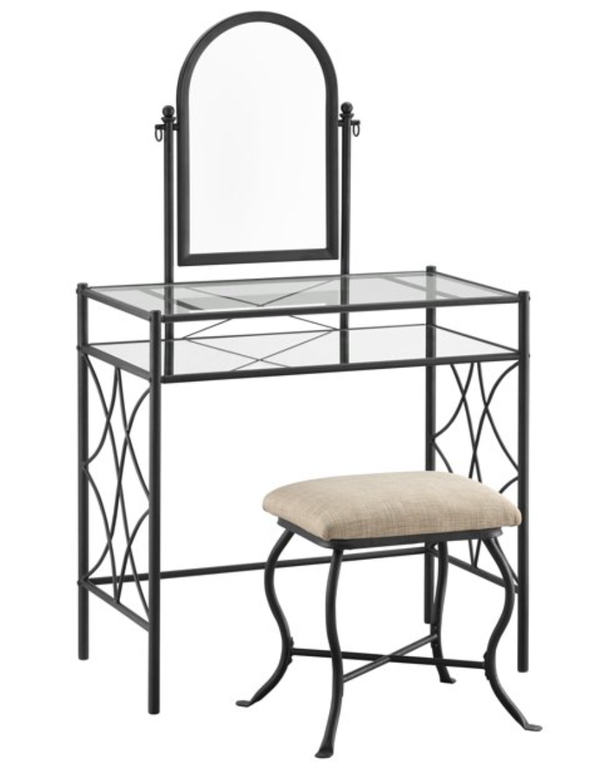 Iron and glass vanity table with attached arched mirror and accompanying upholstered stool.