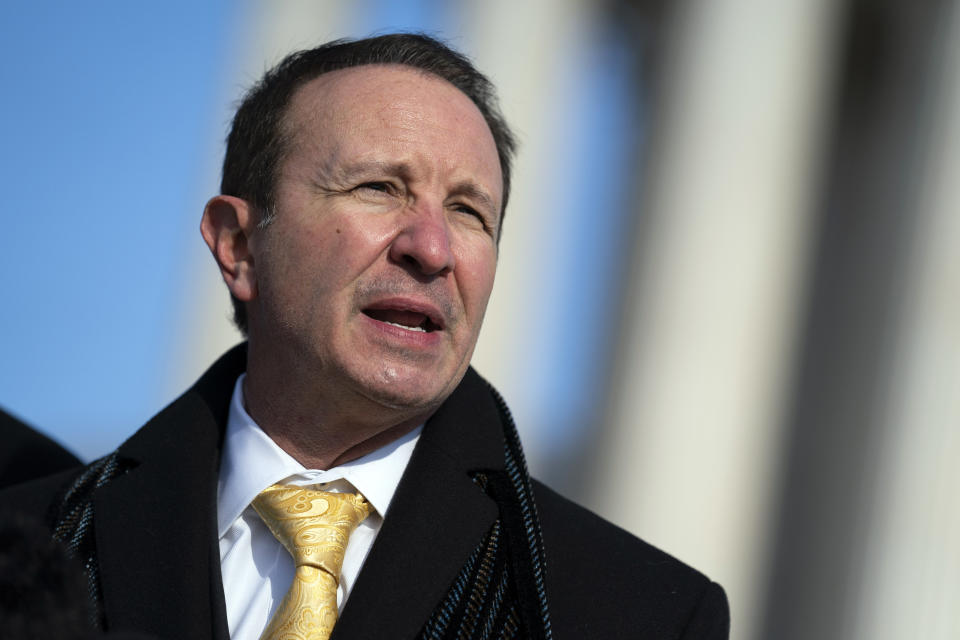 FILE - Louisiana Attorney General Jeff Landry talks to reporters outside the Supreme Court, Jan. 7, 2022, in Washington. As public frustration over Louisiana’s violent crime grows, Landry is backing legislation that would make confidential juvenile court records public in three of the state’s parishes, all of which are predominately Black. (AP Photo/Evan Vucci, File)