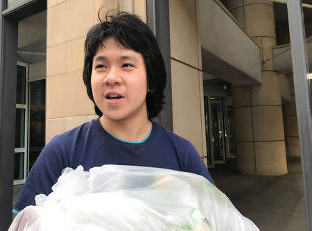 Amos Yee, 18, stands outside the United Sates Citizenship and Immigration Services offices after his release from detention in Chicago, Illinois, U.S., September 26, 2017. REUTERS/Chris Kenning.