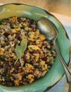 <p>Combine cornbread stuffing with cubed herb seasoning to make this unforgettable side. Paired with sausage, onions, celery, pears and cranberries, this easy three-step stuffing will please everyone.</p><p>Get the <a href="https://www.womansday.com/food-recipes/food-drinks/recipes/a10963/cornbread-stuffing-pears-dried-cranberries-recipe-122243/" rel="nofollow noopener" target="_blank" data-ylk="slk:Cornbread Stuffing with Pears and Dried Cranberries recipe;elm:context_link;itc:0;sec:content-canvas" class="link "><strong>Cornbread Stuffing with Pears and Dried Cranberries recipe</strong></a>.</p>