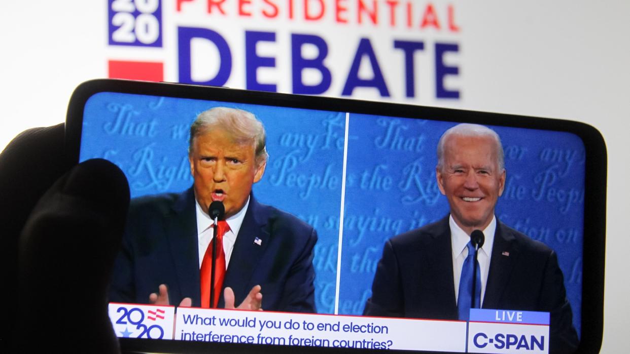  2020 presidential debate between Donald Trump and Joe Biden seen on the screen of a smartphone. 