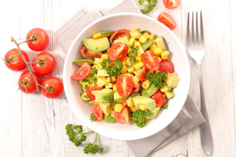 bowl of tomato,corn and avocado salad