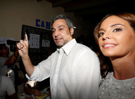 Paraguayan presidential candidate Mario Abdo Benitez of the Colorado Partido shows his inked finger before casting his vote at a polling station during the election in Asuncion, Paraguay, April 22, 2018. REUTERS/Andres Stapff