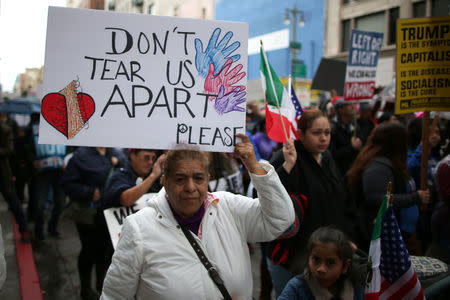 People participate in a protest march calling for human rights and dignity for immigrants, in Los Angeles, February 18, 2017. REUTERS/Lucy Nicholson